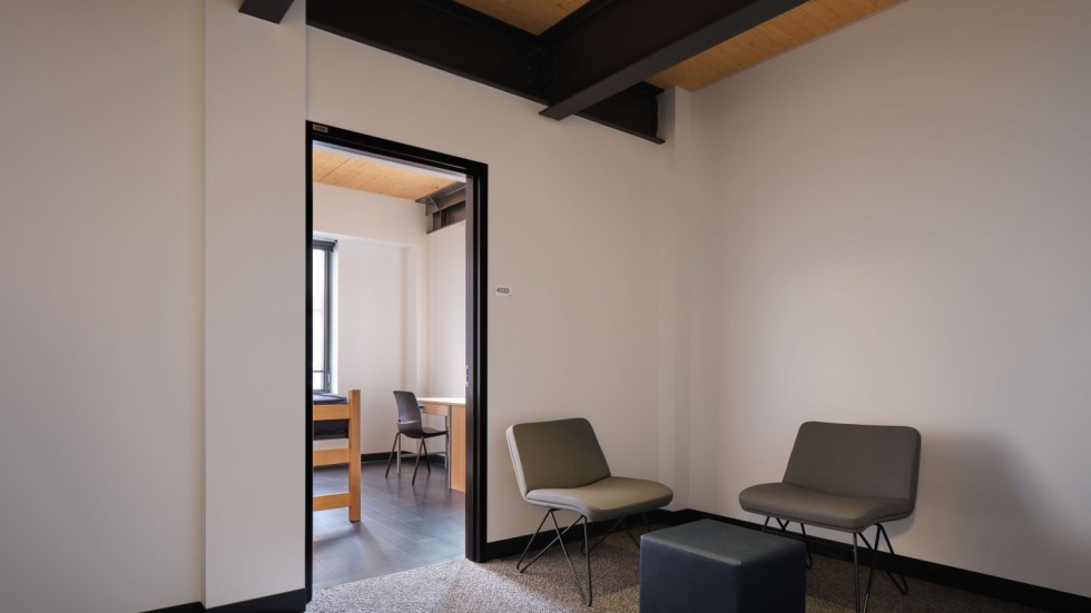 Chairs and bed inside a dormitory