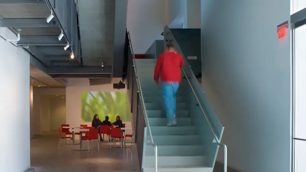 Person walking up staircase